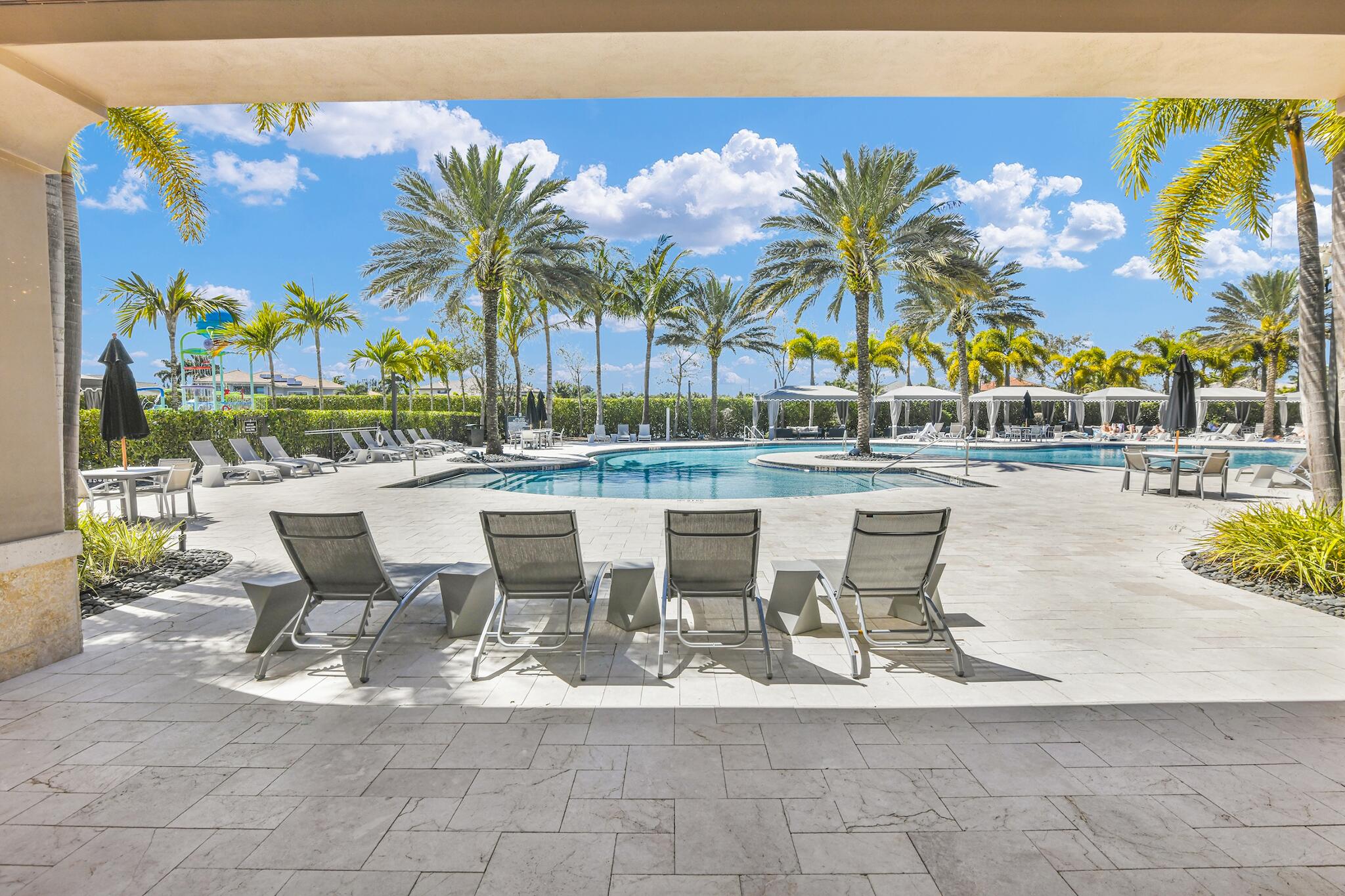 9577 Eden Roc Court Delray Beach, FL 33446 - Photo 33 of 53 a view of a swimming pool with outdoor seating