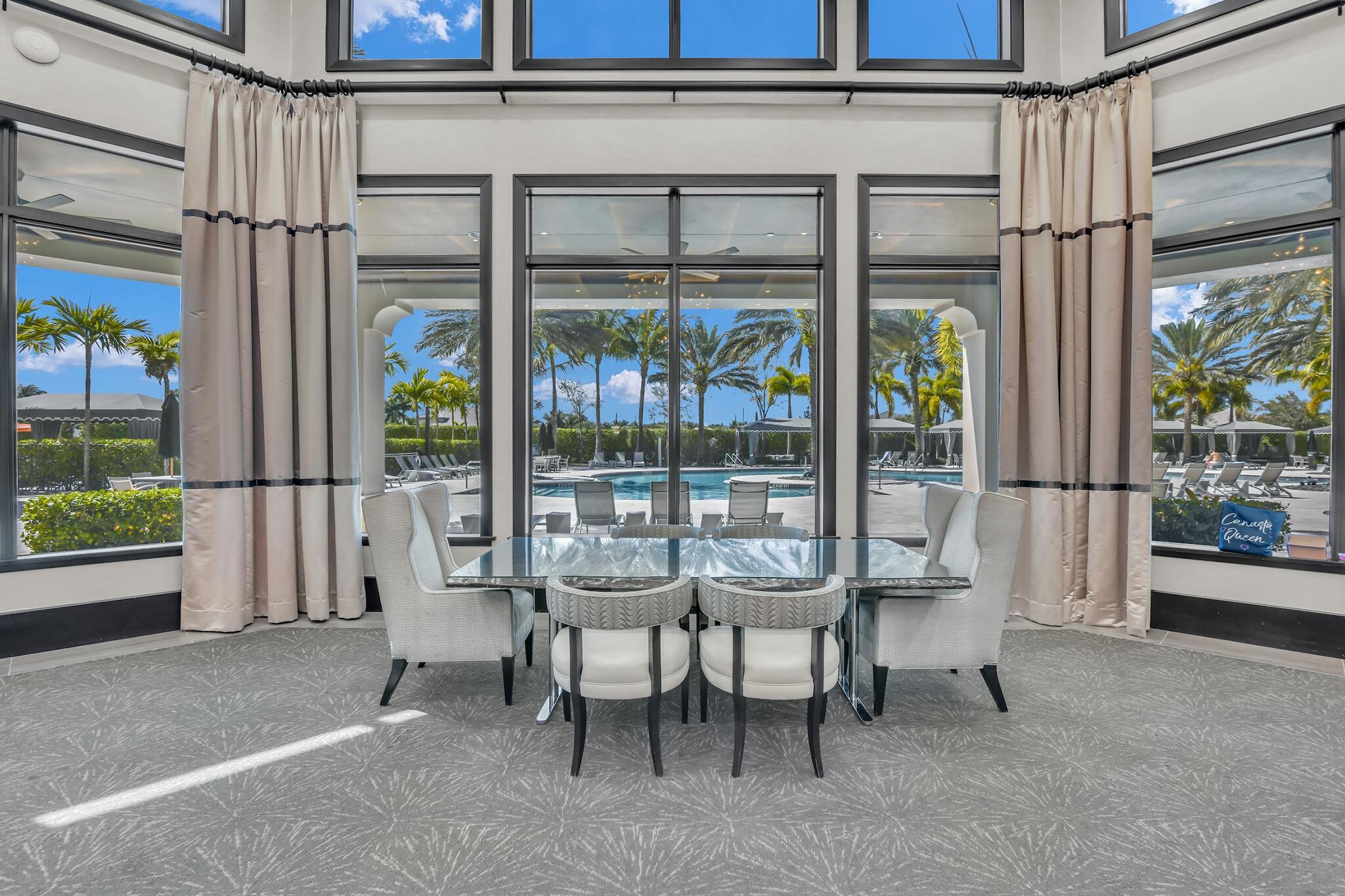 9577 Eden Roc Court Delray Beach, FL 33446 - Photo 36 of 53 a balcony with couple of chairs and a swing