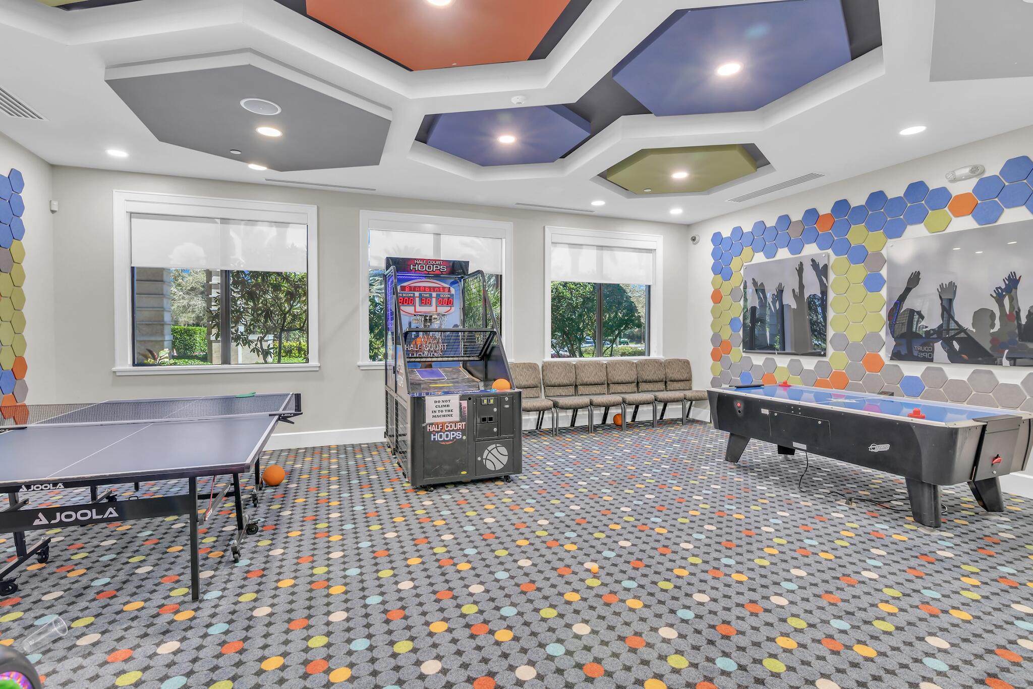 9577 Eden Roc Court Delray Beach, FL 33446 - Photo 49 of 53 a living room with furniture a flat screen tv and a table