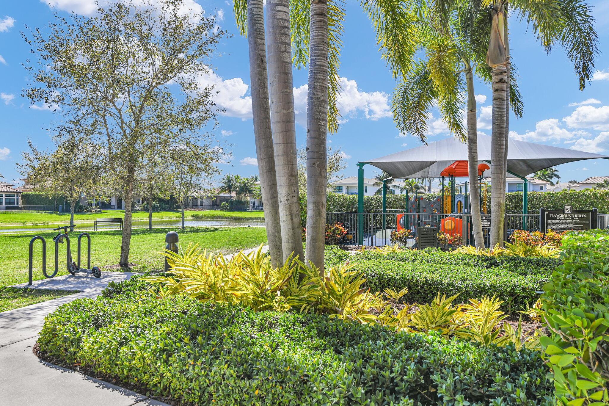 9577 Eden Roc Court Delray Beach, FL 33446 - Photo 51 of 53 a view of a garden with a lake view