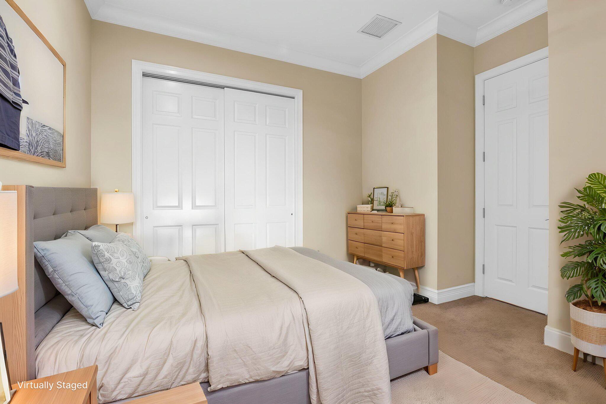 9577 Eden Roc Court Delray Beach, FL 33446 - Photo 10 of 53 a bedroom with a bed and a potted plant