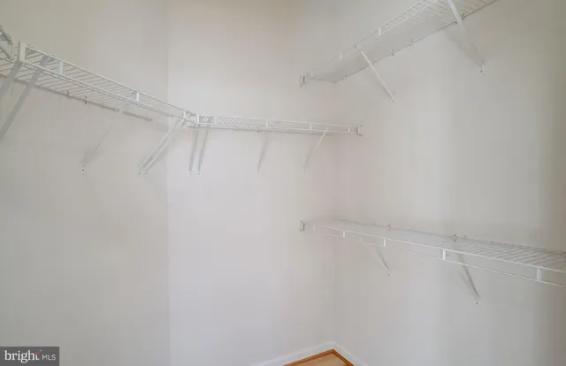 a view of a room with shelf on the wall