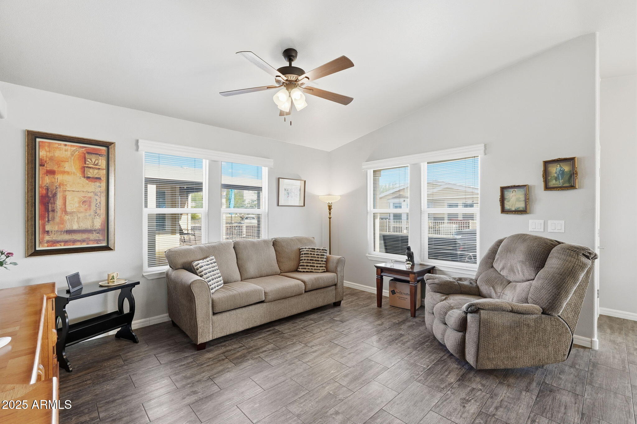 8865 East Baseline Road, Unit 558 Mesa, AZ 85209 - Photo 12 of 54 a living room with furniture and a large window