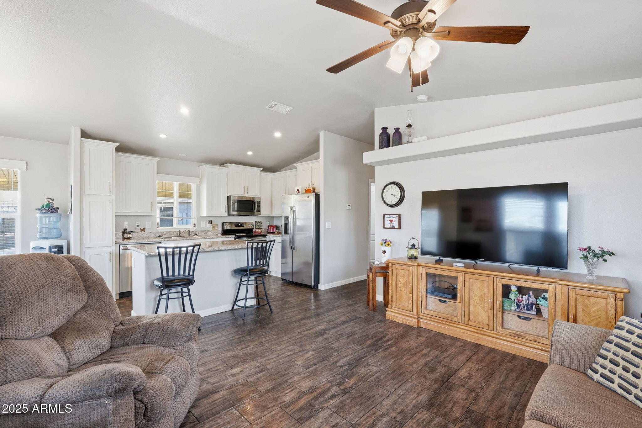 8865 East Baseline Road, Unit 558 Mesa, AZ 85209 - Photo 13 of 54 a living room with furniture and a flat screen tv