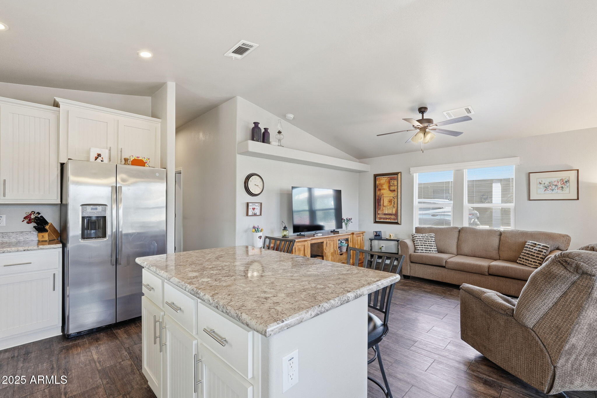 8865 East Baseline Road, Unit 558 Mesa, AZ 85209 - Photo 19 of 54 a living room with stainless steel appliances granite countertop furniture and fireplace