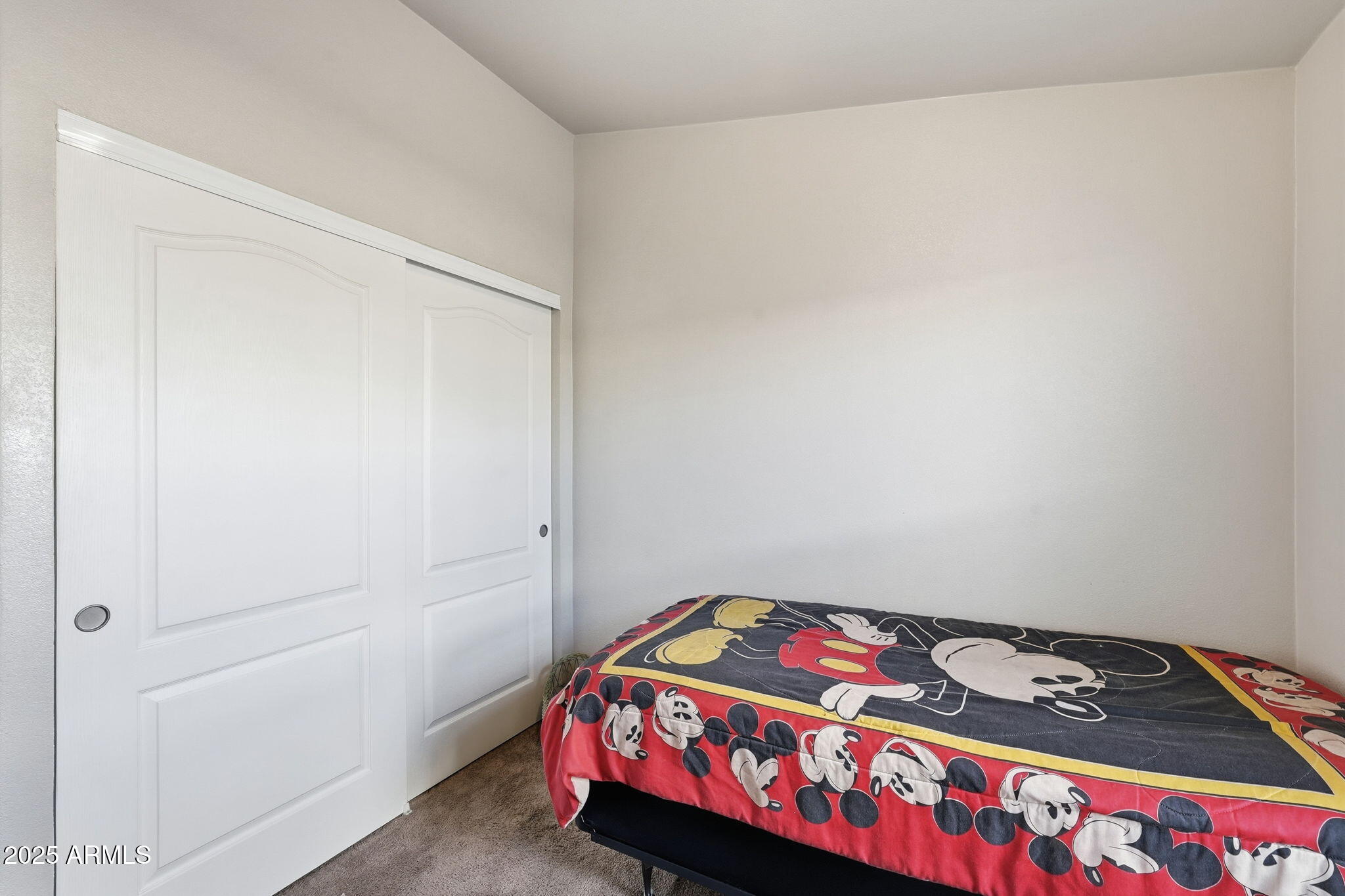 8865 East Baseline Road, Unit 558 Mesa, AZ 85209 - Photo 25 of 54 a bedroom with a bed and a dresser