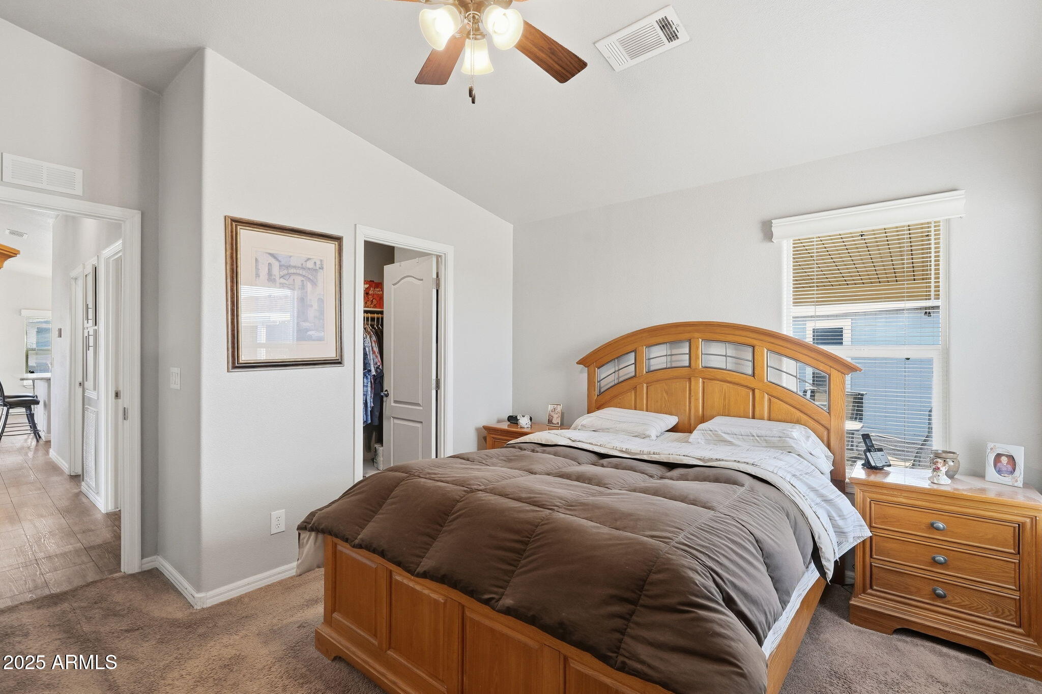 8865 East Baseline Road, Unit 558 Mesa, AZ 85209 - Photo 28 of 54 a bedroom with a bed and a window