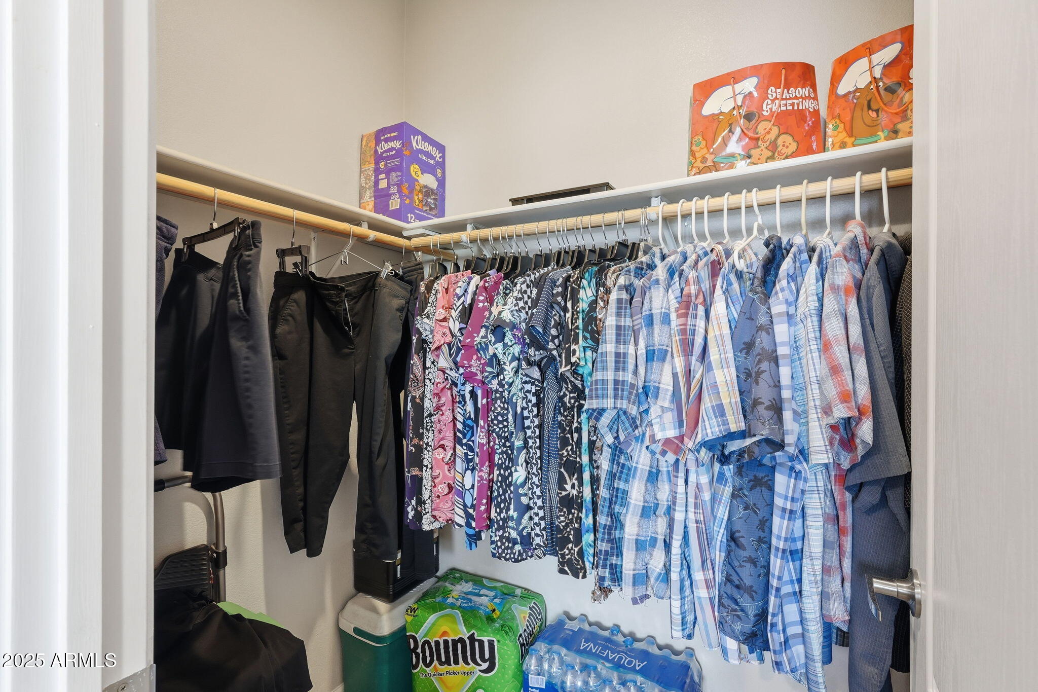 8865 East Baseline Road, Unit 558 Mesa, AZ 85209 - Photo 31 of 54 a view of walk in closet with clothes and shoes