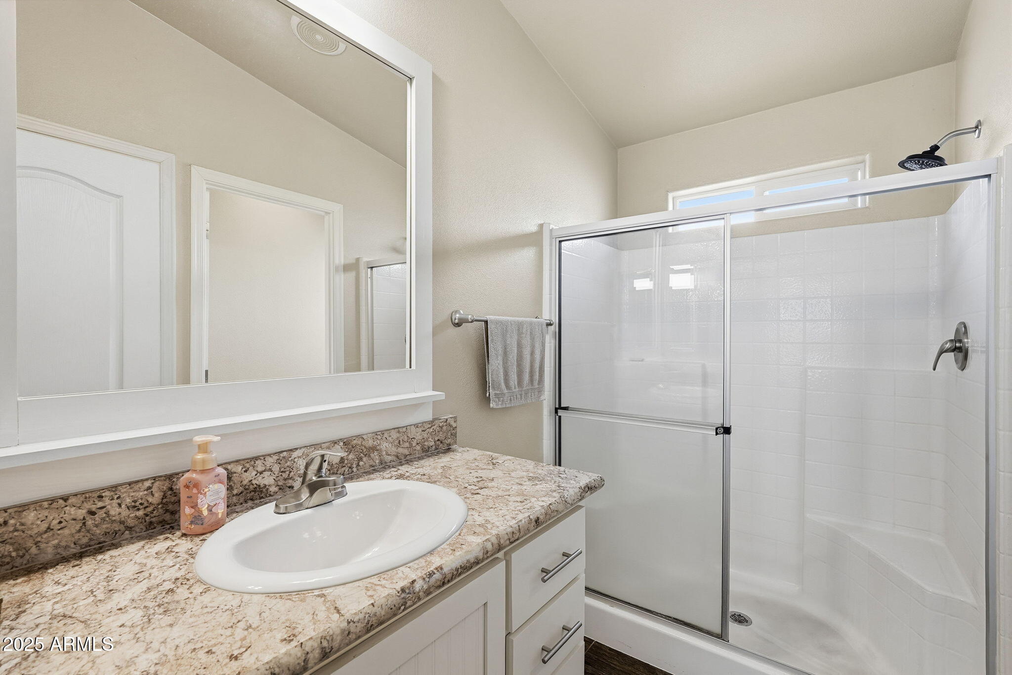 8865 East Baseline Road, Unit 558 Mesa, AZ 85209 - Photo 32 of 54 a bathroom with a granite countertop shower sink and mirror