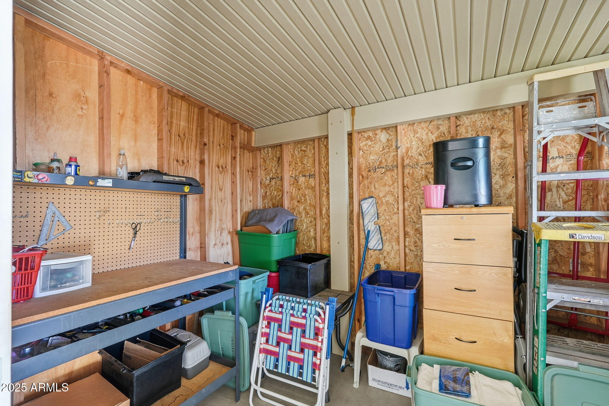 8865 East Baseline Road, Unit 558 Mesa, AZ 85209 - Photo 34 of 54 a kitchen with stainless steel appliances kitchen island granite countertop a refrigerator and a stove