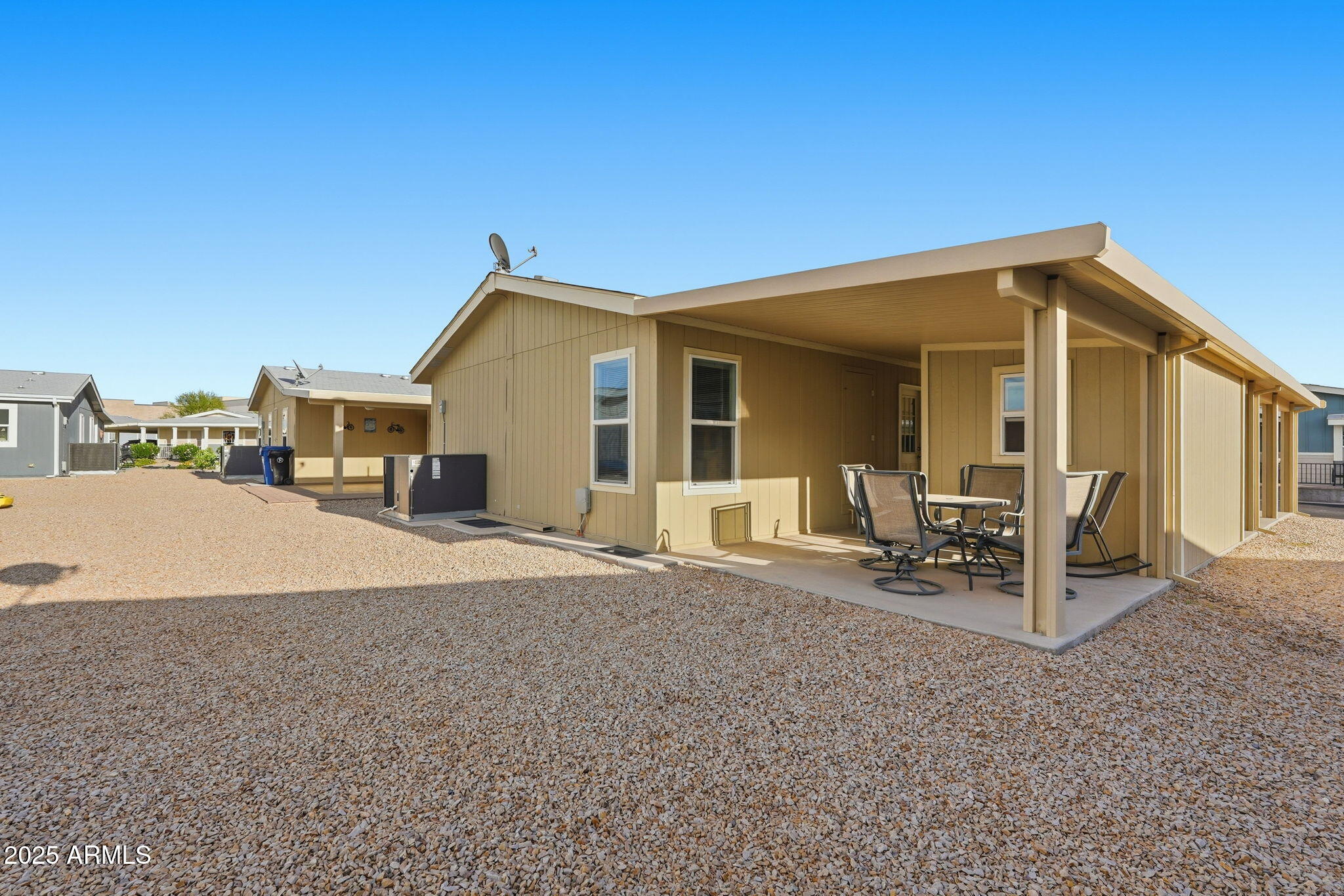 8865 East Baseline Road, Unit 558 Mesa, AZ 85209 - Photo 36 of 54 a view of a house with backyard and porch