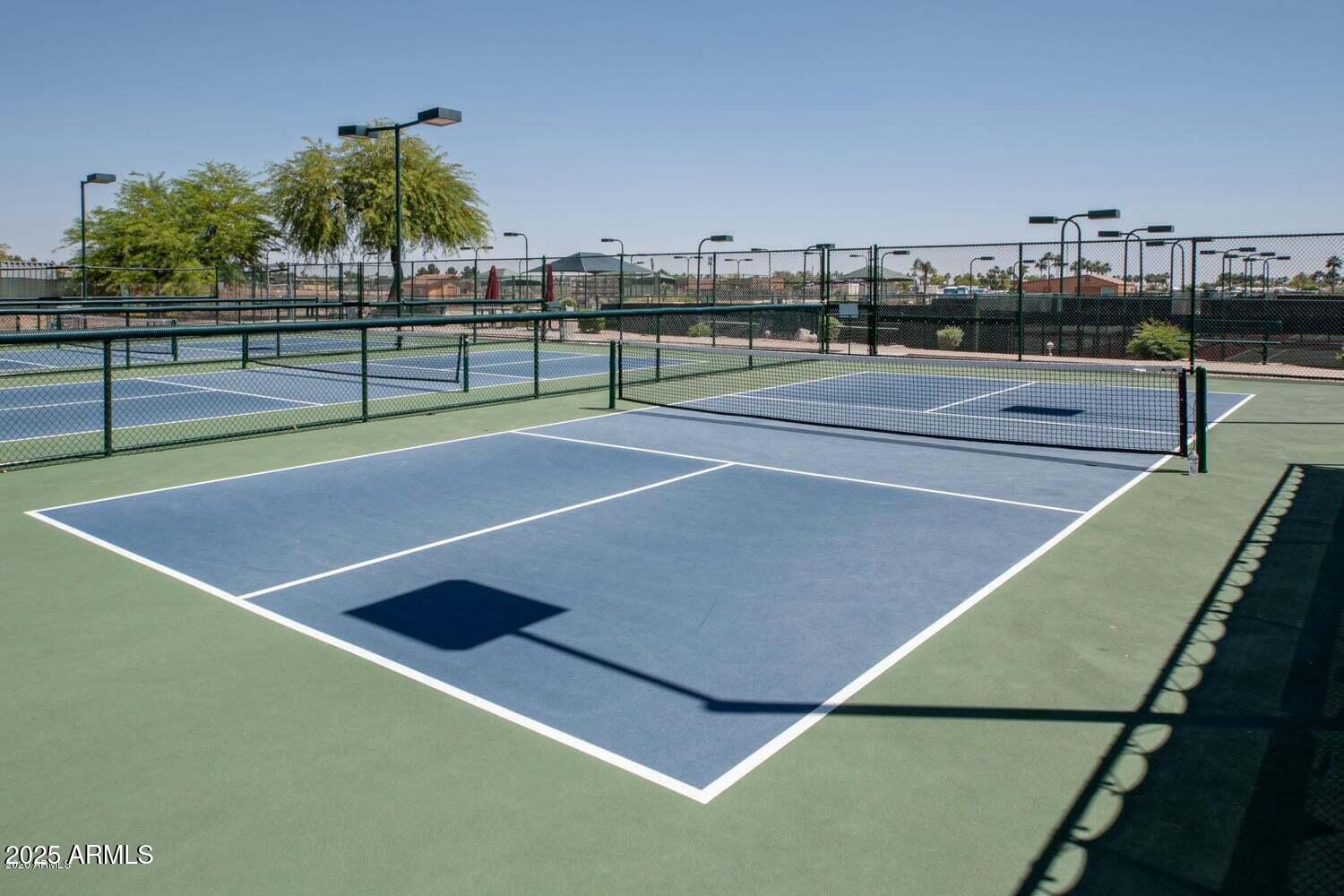 8865 East Baseline Road, Unit 558 Mesa, AZ 85209 - Photo 44 of 54 a view of a tennis court