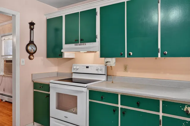 a kitchen with a stove and a sink