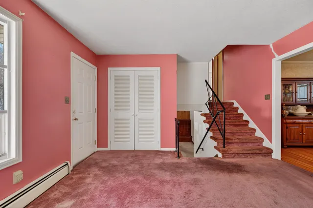a view of a livingroom with stairs