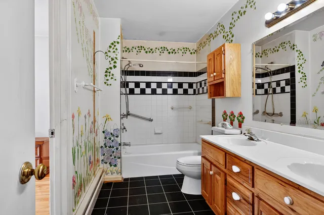 a bathroom with a sink a mirror and a bathtub