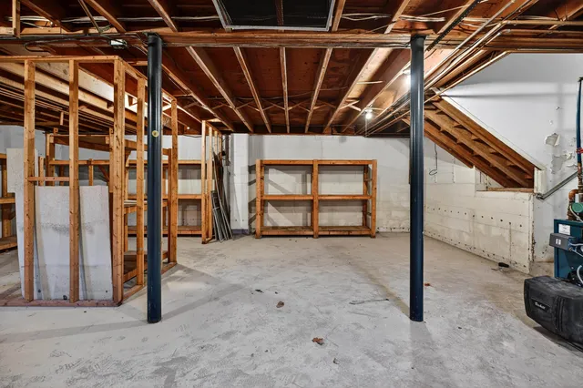 a view of an empty room with wooden walls