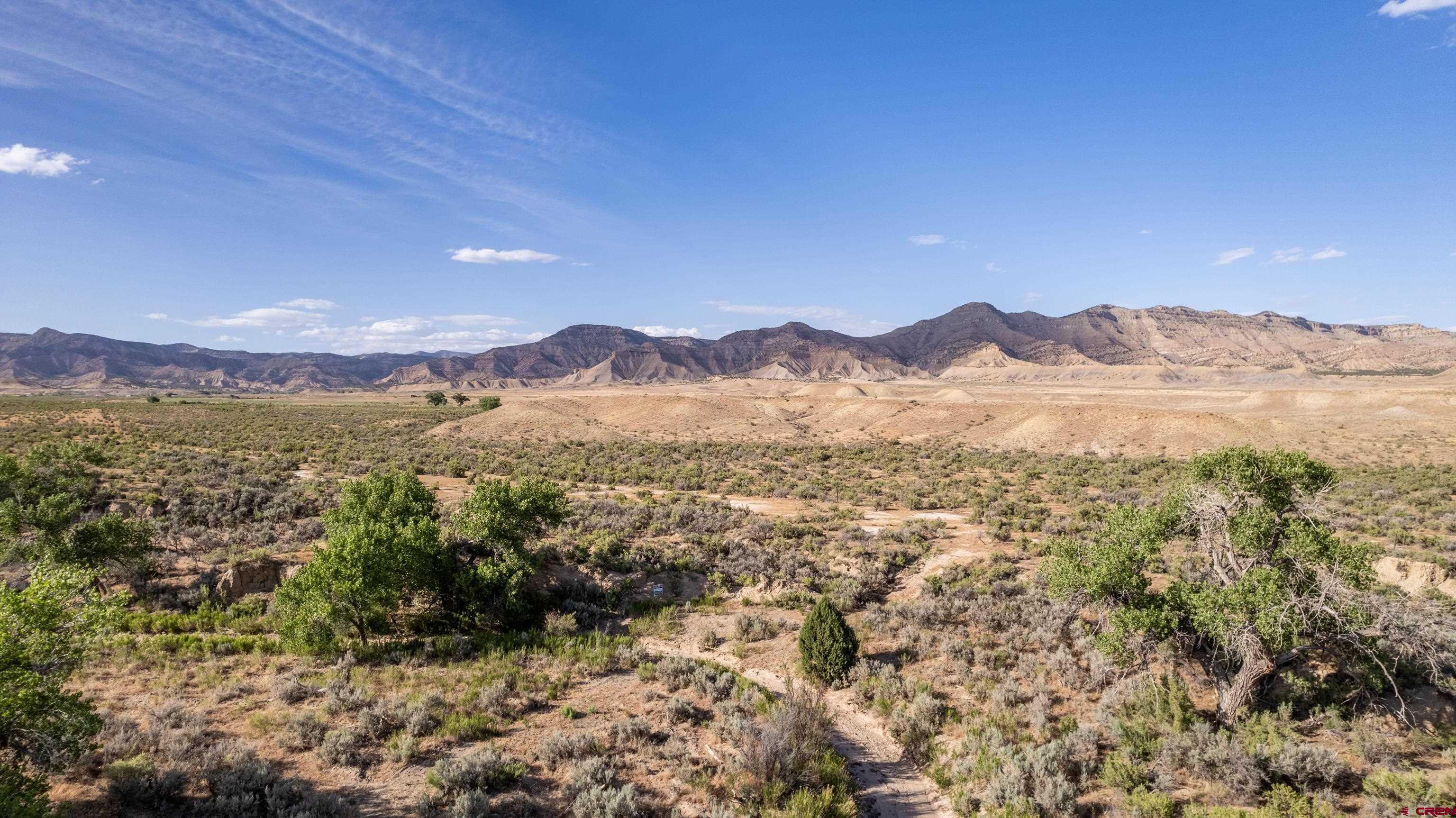Lot 3 16 Road Loma, CO 81524 - Photo 32 of 35 a view of a town with mountains in the background