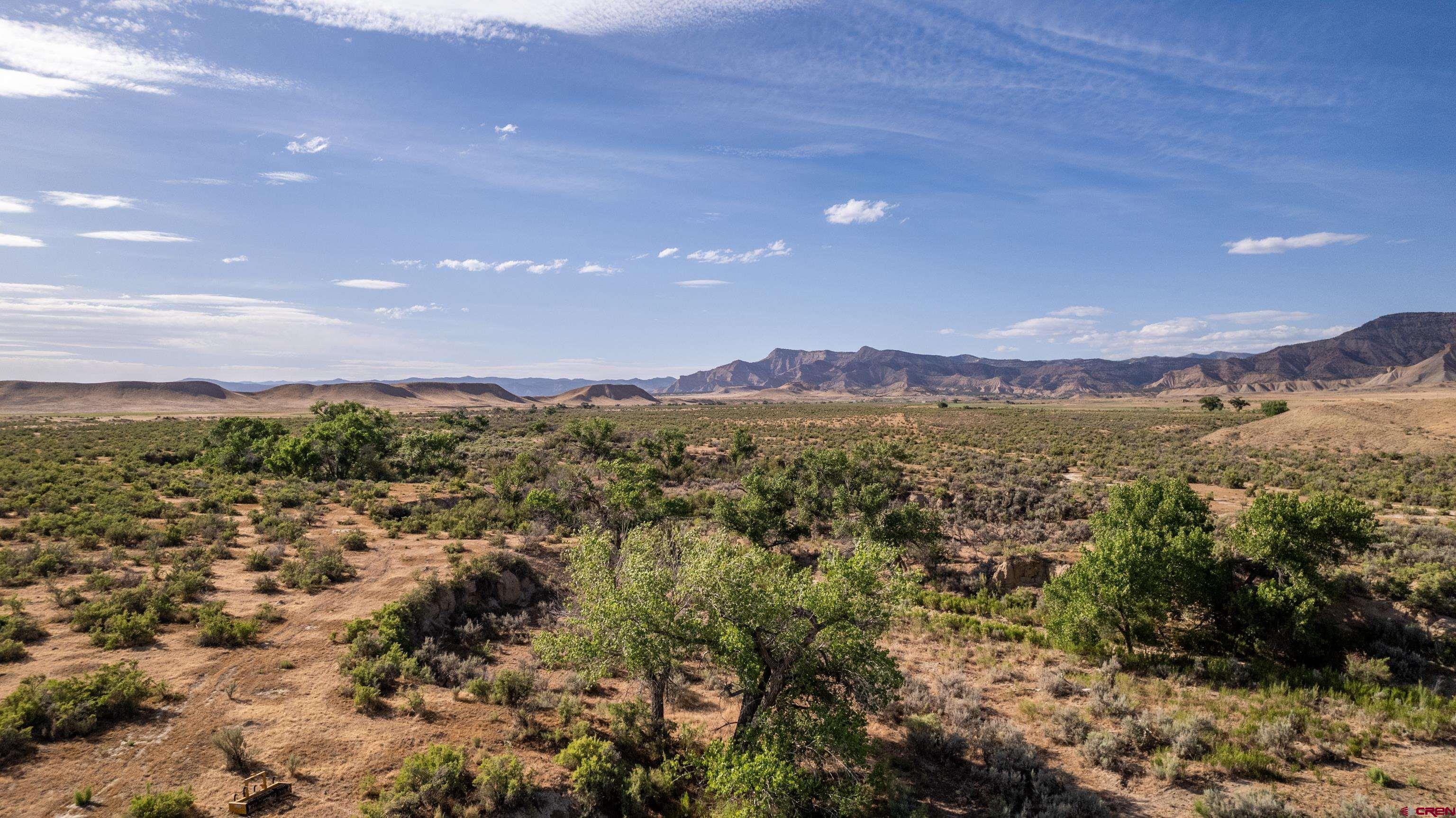 Lot 3 16 Road Loma, CO 81524 - Photo 33 of 35 a view of a city with mountains in the background