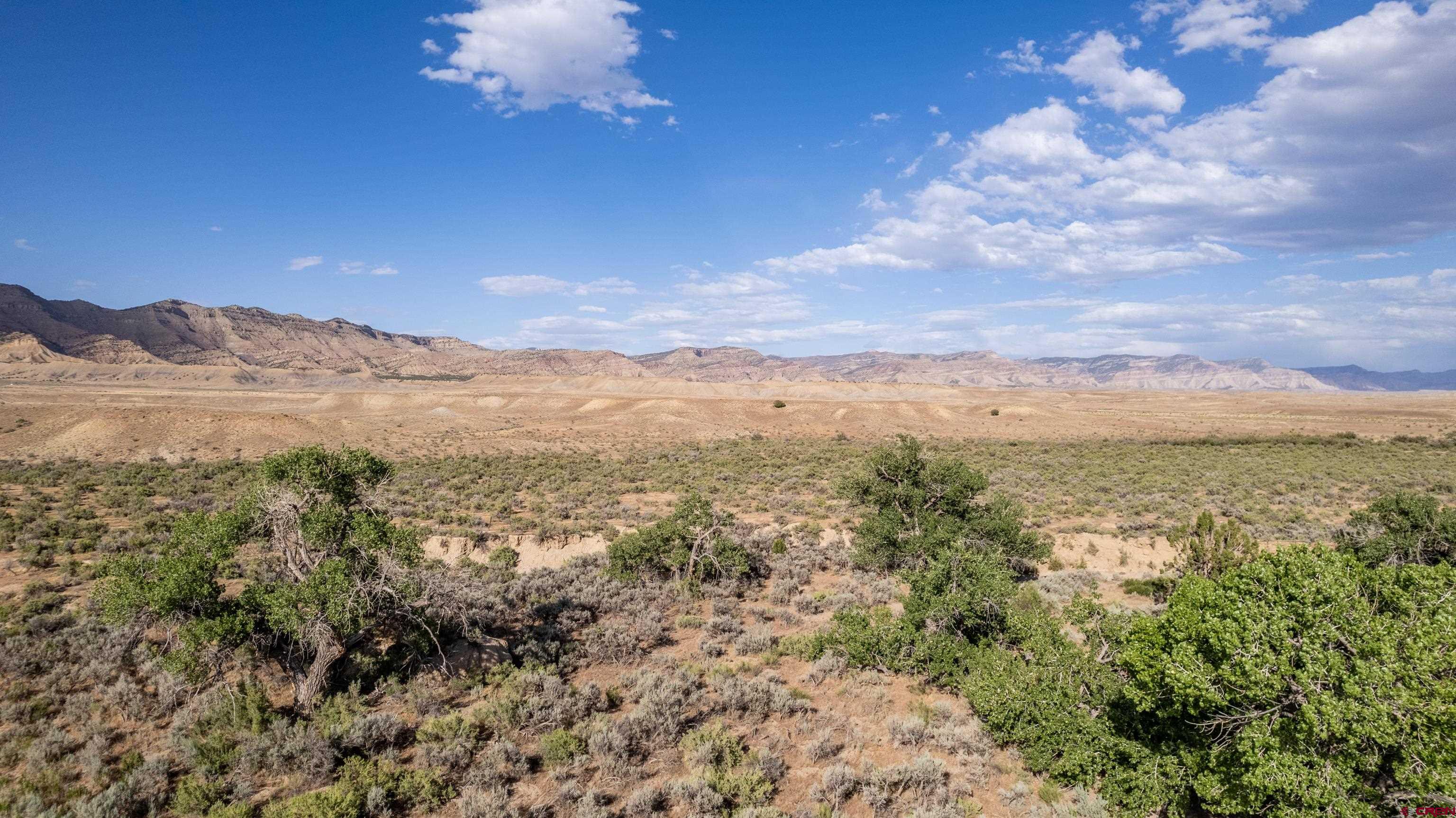 Lot 3 16 Road Loma, CO 81524 - Photo 34 of 35 a view of a city with mountains in the background