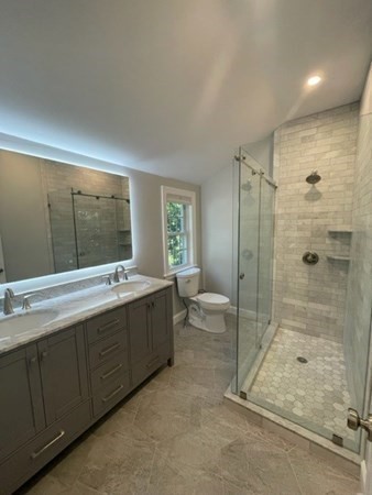 47 Bow Street Saugus, MA 01906 - Photo 12 of 31 a large bathroom with a tub sink shower and mirror