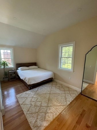 47 Bow Street Saugus, MA 01906 - Photo 13 of 31 a bedroom with a bed and wooden floor