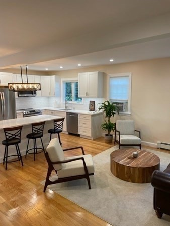 47 Bow Street Saugus, MA 01906 - Photo 17 of 31 a living room with dining room and kitchen view