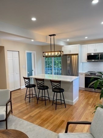 47 Bow Street Saugus, MA 01906 - Photo 20 of 31 a view of a dining room with furniture window and wooden floor