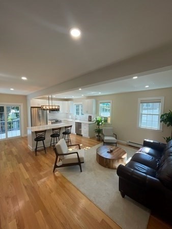 47 Bow Street Saugus, MA 01906 - Photo 24 of 31 a living room with furniture and a wooden floor