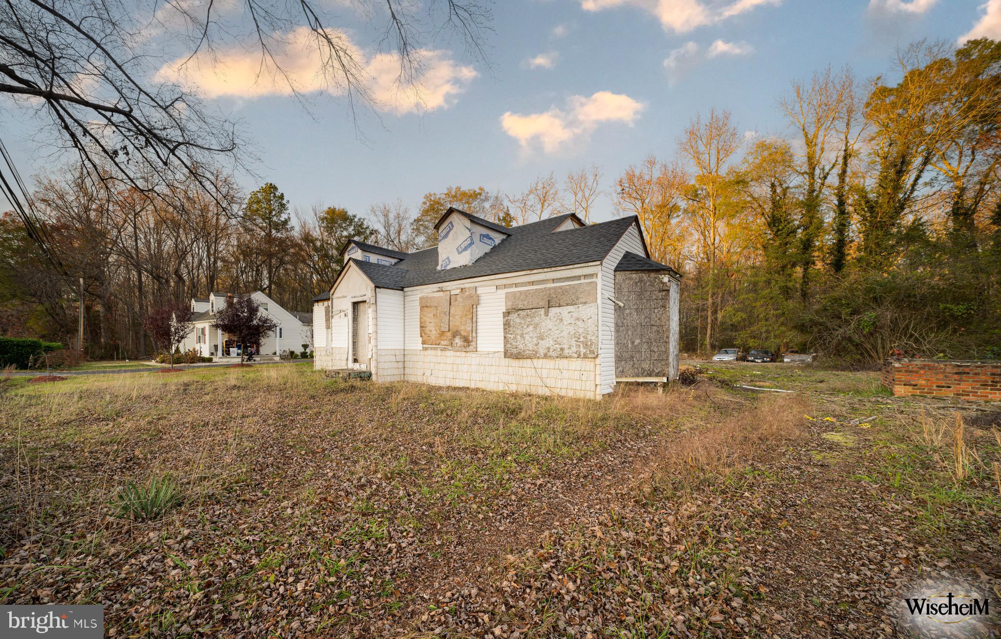 7626 Leonardtown Road Hughesville, MD 20637 - Photo 3 of 18 a front view of a house with a yard