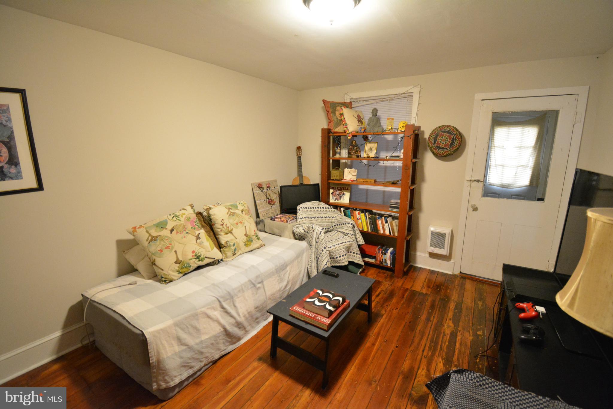 5 Penn Court Philadelphia, PA 19144 - Photo 11 of 23 a living room with furniture and a flat screen tv