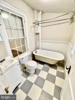 a bathroom with a toilet a sink and a shower
