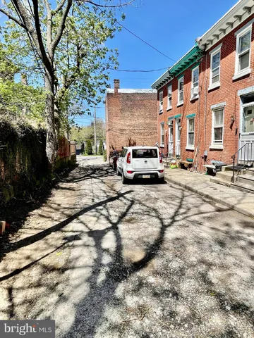 a view of street with parked cars