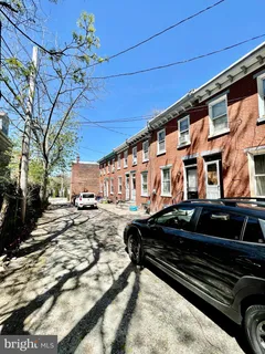 a view of a car park in front of house