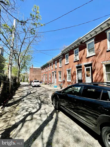 a view of a car park in front of house