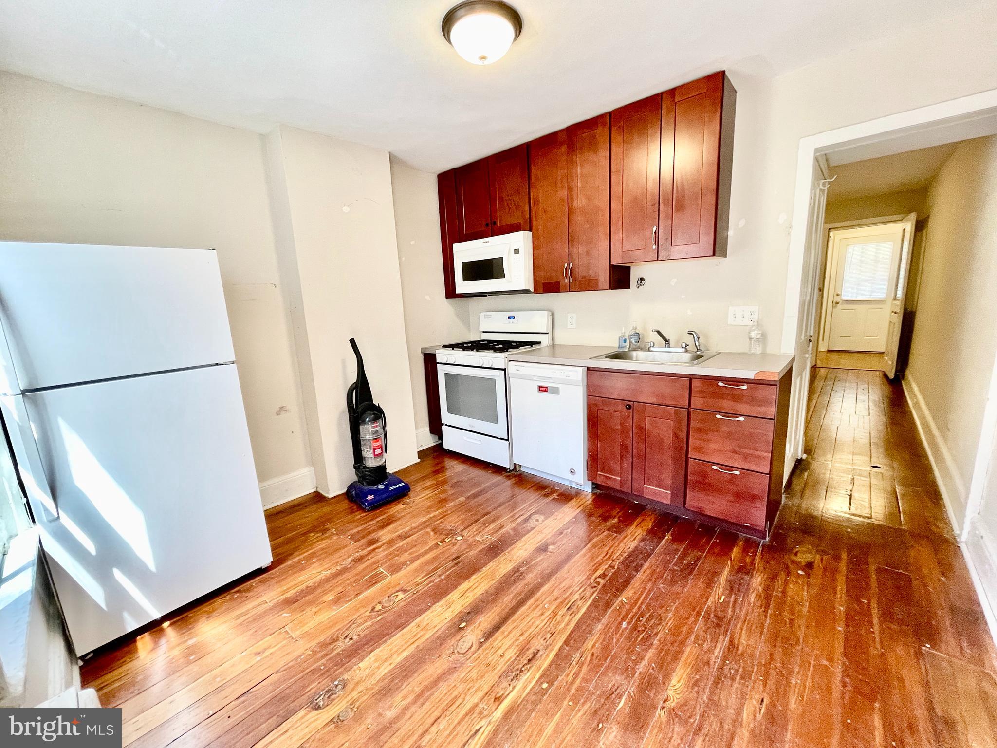 5 Penn Court Philadelphia, PA 19144 - Photo 6 of 23 a room with wooden floors and appliances