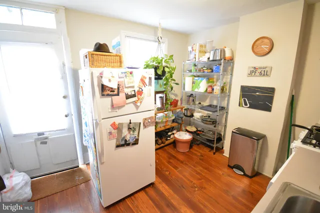 a view of a living room with furniture and a flat screen tv