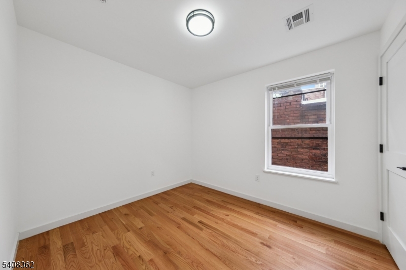 52 James Street, Unit 3 Newark, NJ 07102 - Photo 9 of 25 an empty room with a window