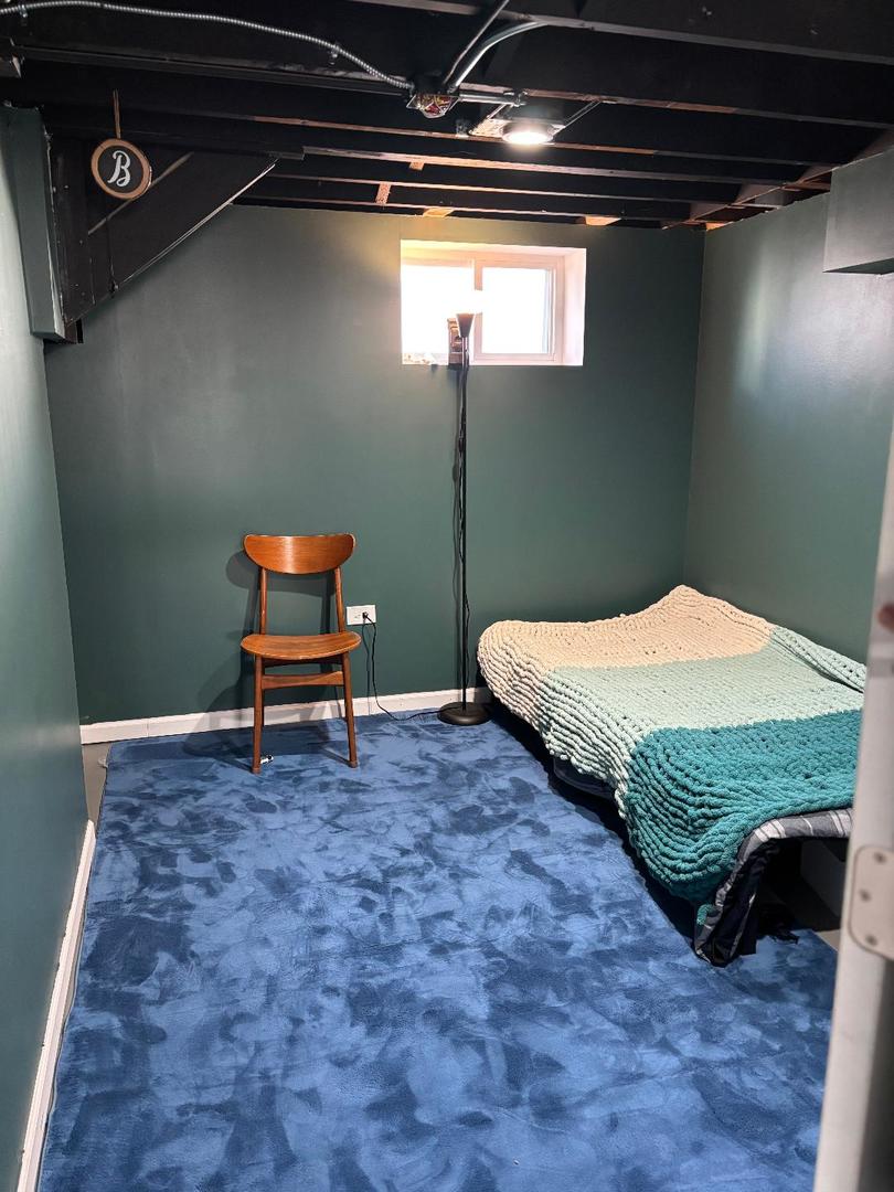 3227 Harrison Avenue Brookfield, IL 60513 - Photo 21 of 21 a bedroom with a bed and a chair