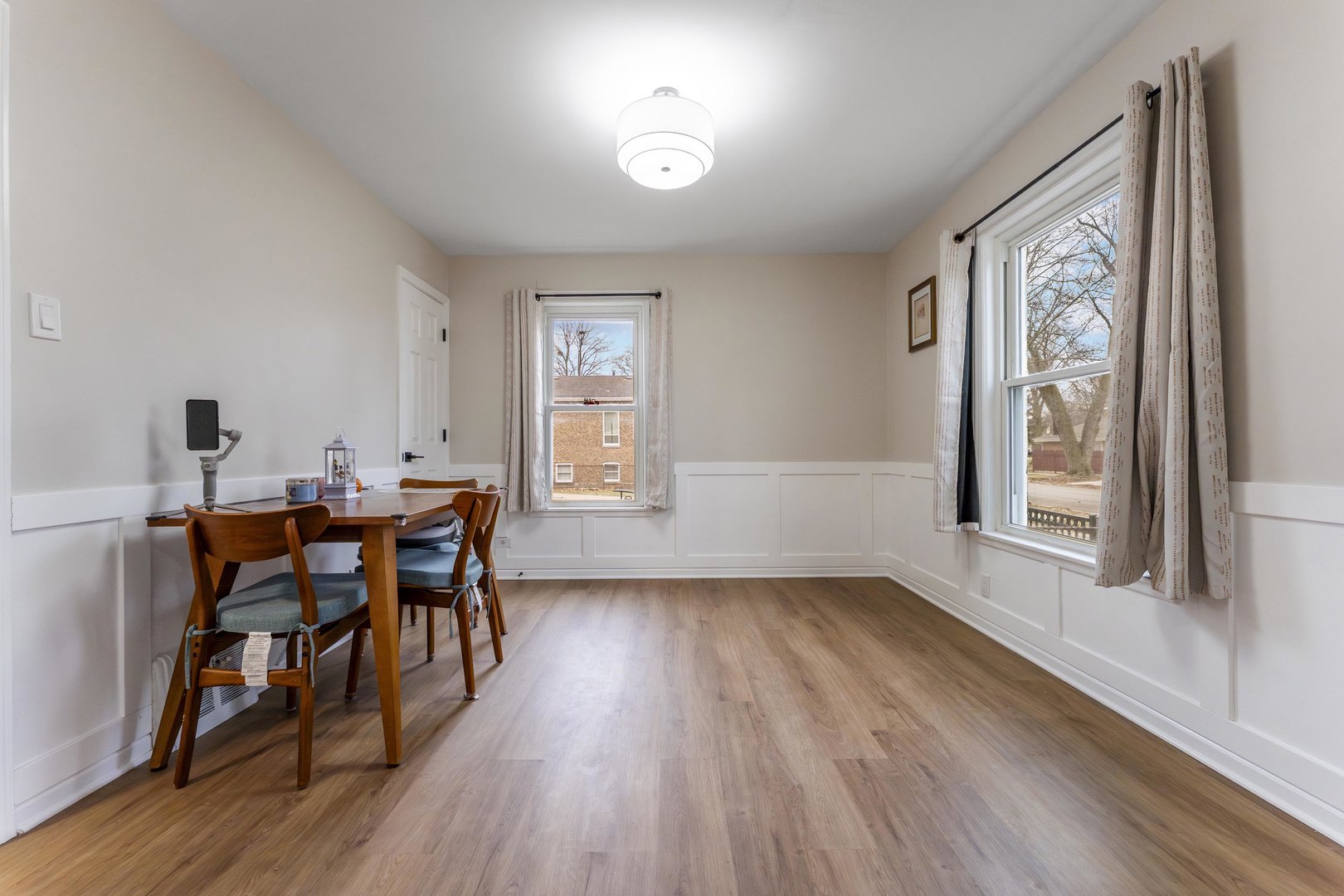 3227 Harrison Avenue Brookfield, IL 60513 - Photo 5 of 21 a view of a dining room with furniture and wooden floor