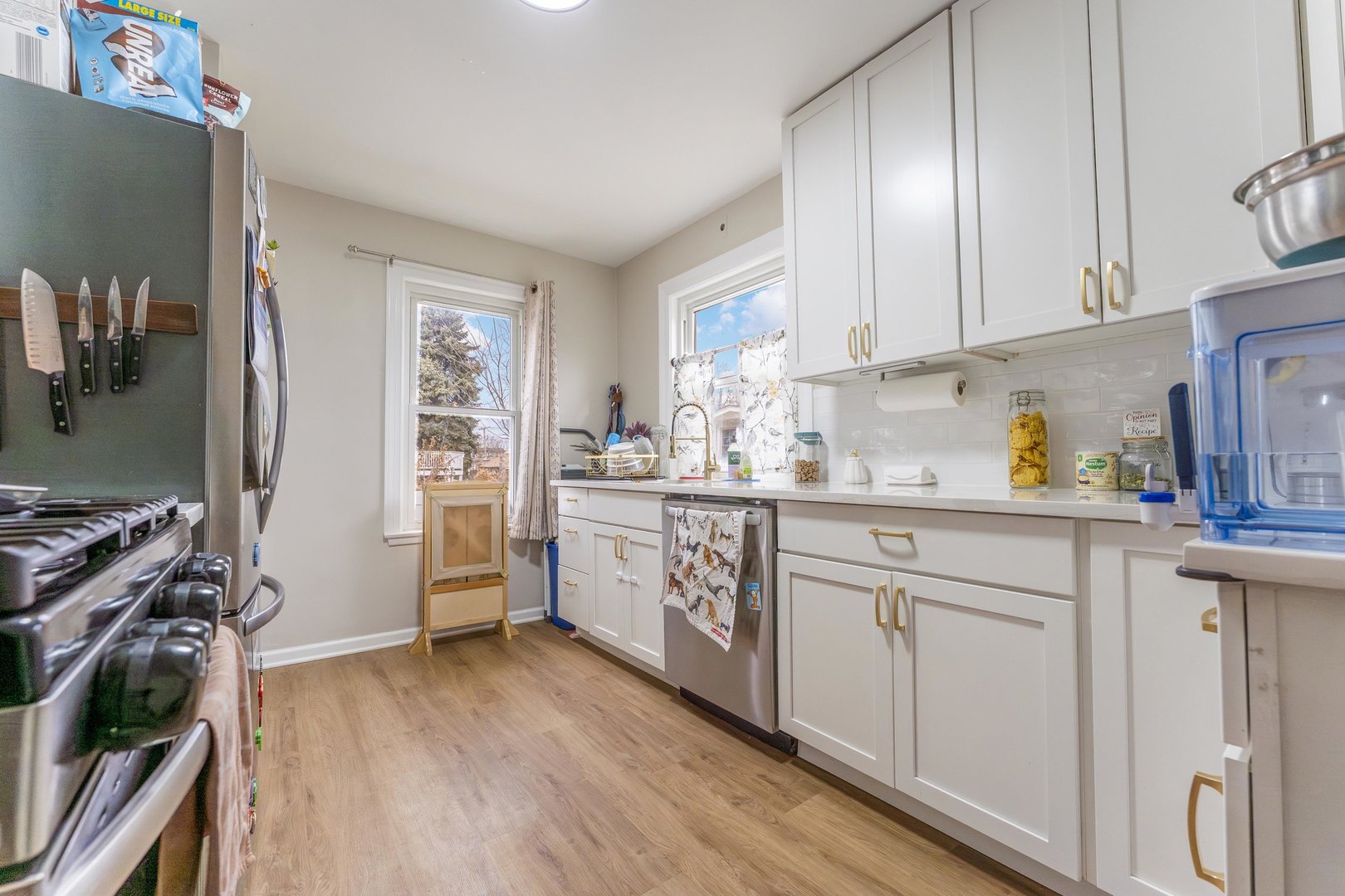 3227 Harrison Avenue Brookfield, IL 60513 - Photo 7 of 21 a kitchen with a sink appliances cabinets and a window