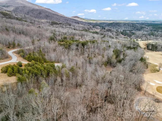 a view of a backyard of the house