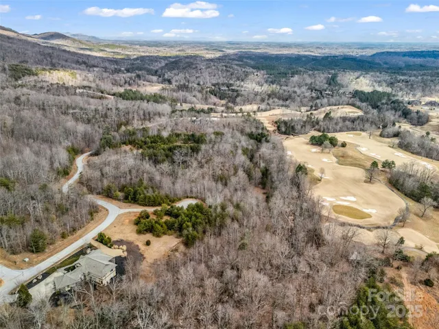 a view of a backyard of the house