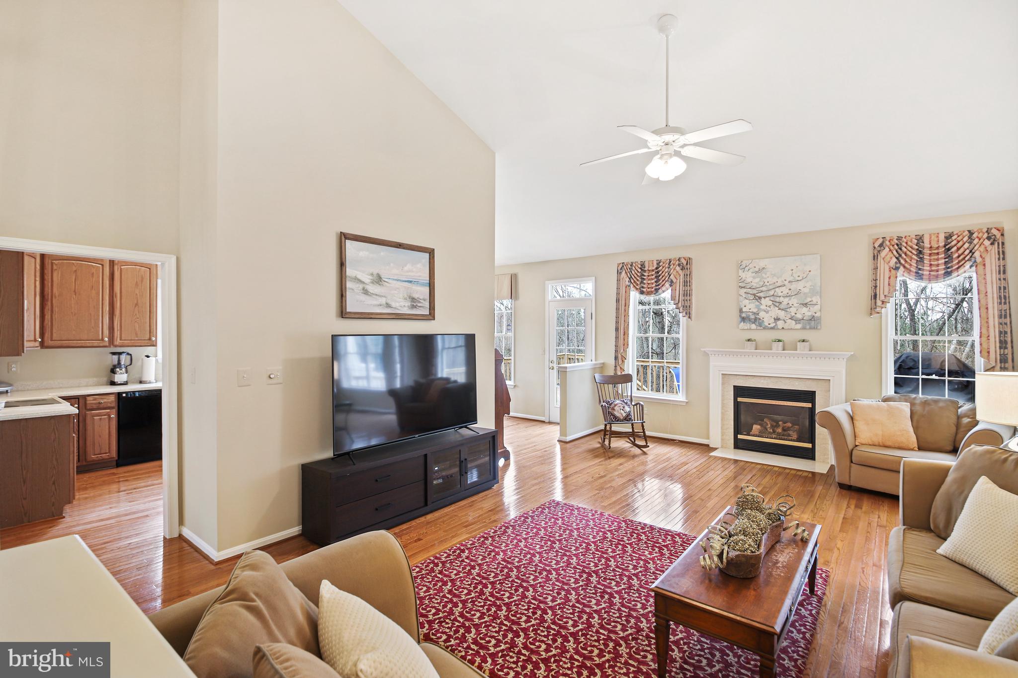 13558 Ryton Ridge Lane Gainesville, VA 20155 - Photo 29 of 63 The living room opens to the sunroom and kitchen.