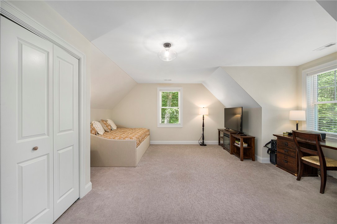 936 S Road East Greenwich, RI 02818 - Photo 24 of 31 Second floor Bonus room. Laundry is housed behind the doors to the left. No need to haul laundry to the first floor or basement!