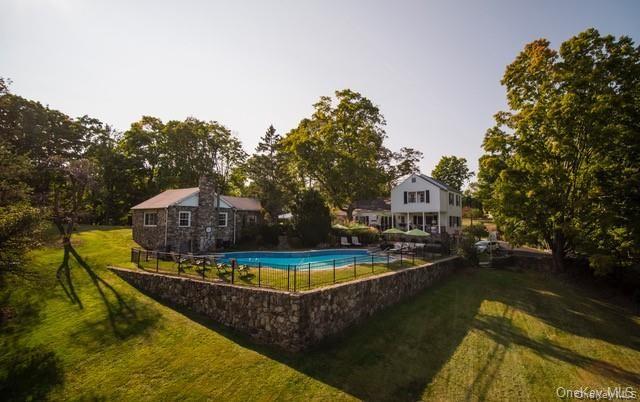 651 Lakes Road Monroe, NY 10950 - Photo 7 of 7 View of swimming pool featuring a yard