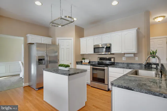 a kitchen with counter space cabinets and appliances