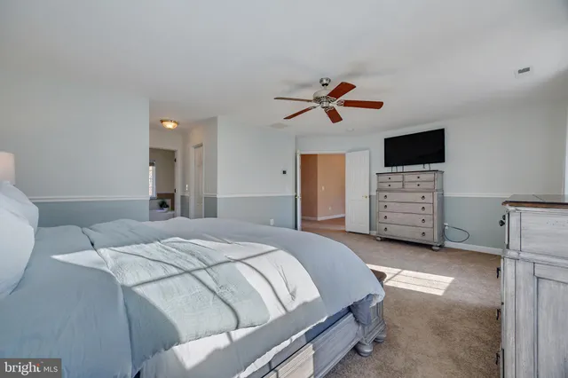 a bed room with a bed and a television