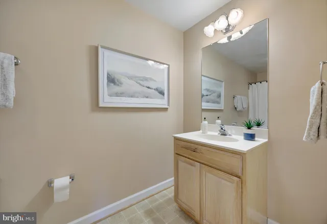 a bedroom with a bed and lamp