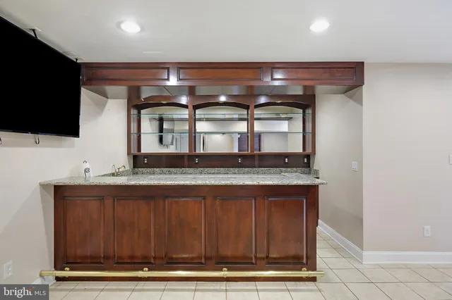 a kitchen with stainless steel appliances granite countertop a sink and a microwave
