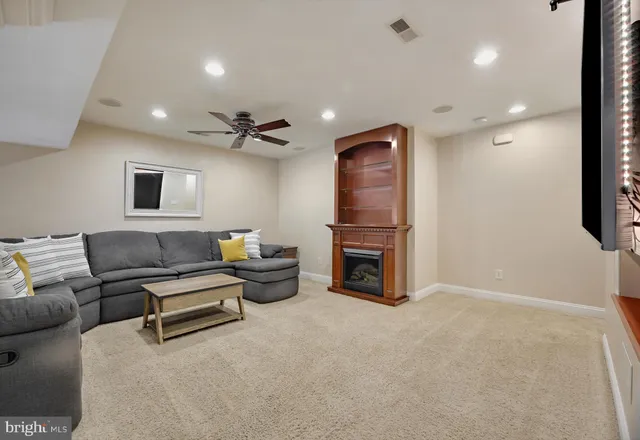 a view of a livingroom with furniture and a flat screen tv